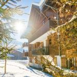 Slide Extérieur des chalets enneigés aux Fermes de Samoëns by Ateya Vacances