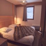 Slide Chambre avec lit double dans la Résidence Les Grandes Feignes à la Bresse