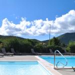 Slide Swimming pool overlooking the village of Montbrun at the Le Hameau des Sources residence