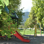 Slide Children's playground in the small park near the Le Hameau des Sources by Ateya residence in Montbrun