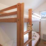 Slide room with a bunk bed that can accommodate two people in the Ours Blanc residence