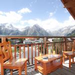 Slide balcony with beautiful views of the mountains from the Deux Alpes resort at the L'Ours Blanc residence