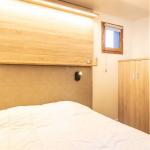 Slide Chambre avec un lit double dans un appartement de la résidence Le Beauregard