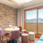 Slide Living room with sofa in a mountain apartment within the Le Beauregard residence