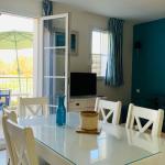 Slide Dining table with view of the golf course at the Résidence Les Maisons du Golf de la Cabre d'Or *** by Ateya - Cabriès