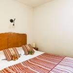 Slide room with a double bed for 2 people and a window overlooking the mountains at Les Fermes de Samoens residence