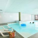 Slide Heated indoor swimming pool in the Les Chalets du Beleveder residence