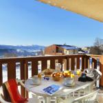 Slide Balcony with garden furniture and mountain views at Les Chalets du Belveder residence