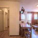 Slide Overall view of the flat with a glimpse of the hallway and living room in a mountain flat in Orcière