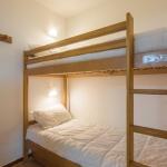 Slide Sleeping area with bunk beds in a mountain apartment in the resort of Orcières
