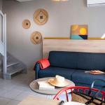 Slide Living room in 2-bedroom houses at Domaine du Golf by Ateya in Fabrègues with garden view
