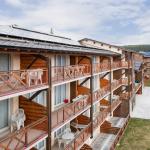 Slide Exterior of the Pyrénées 2000 residence with a close-up of the balconies in summer