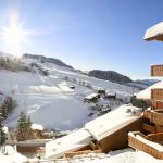 Slide Exterior of the Le Village de Lessy residence in winter