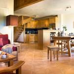 Slide Living area with open kitchen at the Le Village de Lessy residence