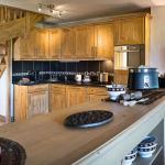 Slide Equipped kitchen open to the living room at the Le Village de Lessy