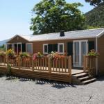 Slide Chalet en bois avec grande terrasse à l’écrin du lac