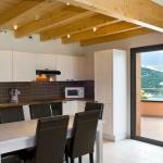 Slide Dining area with fully equipped open kitchen in an apartment in Chorges
