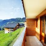 Slide Balcony overlooking greenery in front of the Le Grand Lodge residence in Châtel