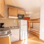Slide Kitchen of a studio at Les Bottières with sleeping area including bunk beds