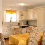 Slide Equipped kitchen open to the dining area in a house at Le Clos des Oliviers residence