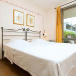 Slide Bedroom with a double bed in the Provence Country Club residence