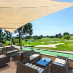 Slide Social area with garden furniture overlooking the golf course at the Provence Country Club residence