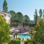 Slide Overall view of the outdoor swimming pool and pine forest in the background at the La Licorne de Haute Provence residence