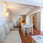 Slide Living room opening onto the lounge and kitchen in one of the Fleur de Sel residence's accommodation units