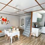 Slide Living room for 4 people with open-plan kitchen and dining table in the Les Tamaris and Les Portes du Soleil residences