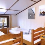 Slide Upstairs bedroom with two single beds in the Les Tamaris and Les Portes du Soleil estate