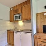 Slide Small fitted kitchen in an apartment in the Grand Bois residence in La Tania Courchevel