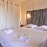 Slide Bedroom with double bed and dressing room in an apartment at Les Collines Iduki