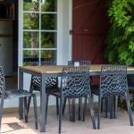 Slide Outdoor terrace with garden furniture at Les Collines Iduki