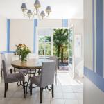 Slide Dining area with table and sideboard in an apartment in the Iduki Hills