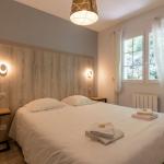 Slide Double bedroom with window overlooking the outside in the Iduki Hills