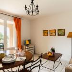 Slide Living/dining room with outdoor balcony in an apartment on the Bourgeac estate
