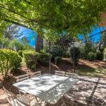 Slide Table and chairs available on the terrace of a hamlet house at Domaine de Saint-Endréol Golf & Spa Resort in La Motte-en-Provence