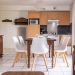 Slide Pièce de vie pour partager de bons moments en famille dans l'un des logements de la résidence Le Domaine du Rois à Bergheim