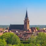 Slide Bergheim and its historic bell tower near the residence Le Domaine des Rois