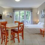 Slide Studio for two with living area and bed in the background at Domaine de Camiole