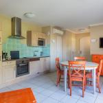 Slide Open kitchen with dining area in an apartment at Domaine de Camiole