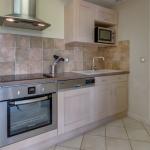 Slide Fully equipped kitchen in a six-person apartment at Domaine de Camiole