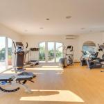 Slide Fitness room with cardio machines at Domaine de Camiole