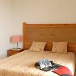 Slide Bedroom with a double bed and bedside tables at La Marquisié