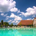 Slide Outdoor pool at Résidence Le Clos du Rocher with sun loungers