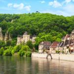 Slide Typical Dordogne village along a river