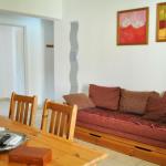 Slide Living room with sofa bed in one of the accommodations at Le Hameau des Sources in Montbrun-les-Bains