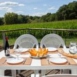 Slide Furnished south-facing balcony with a view of nature at the Hameau de la Chalosse in Cassen, in the Landes