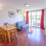 Slide Bright, spacious living room in the apartments at the Hameau de la Chalosse in Cassen