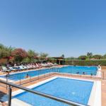 Slide Large uncovered outdoor pool surrounded by sun loungers at Camping del Mar **** in Malgrat de Mar